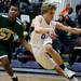Pioneer High School senior William Kirchen dribbles in the game against Huron on Friday, Jan. 18. Pioneer leads at halftime 36-24. Daniel Brenner I AnnArbor.com